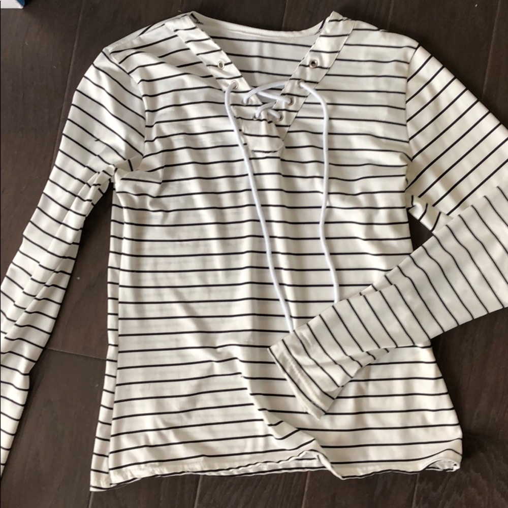 White and black pinstripe long sleeve top.